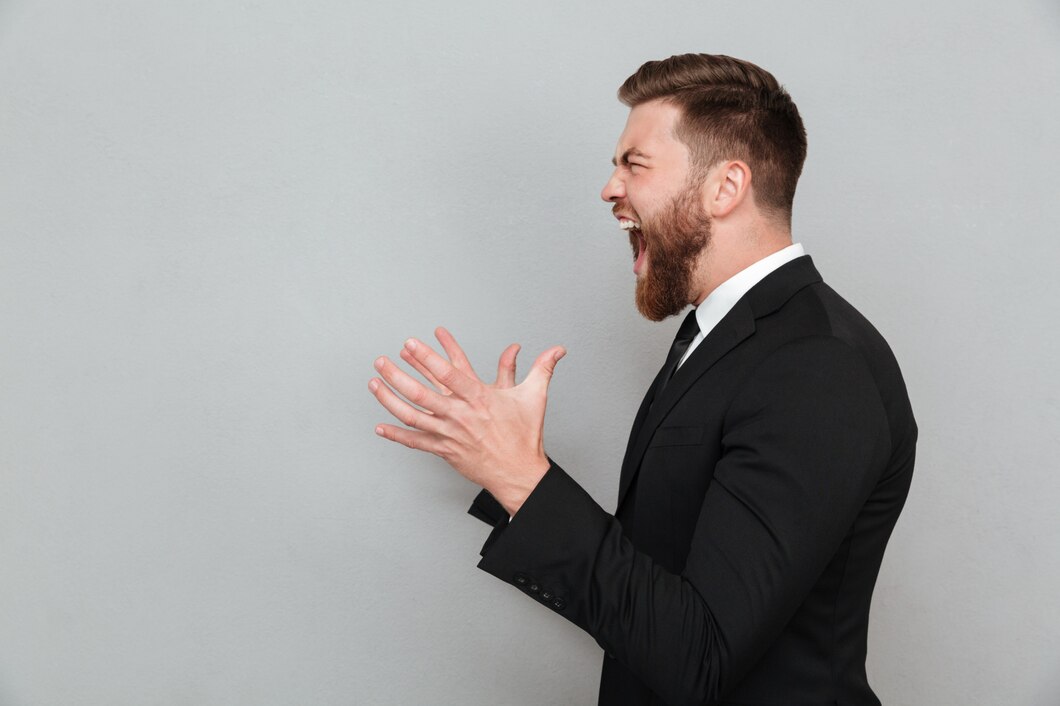 a man in a suit yelling